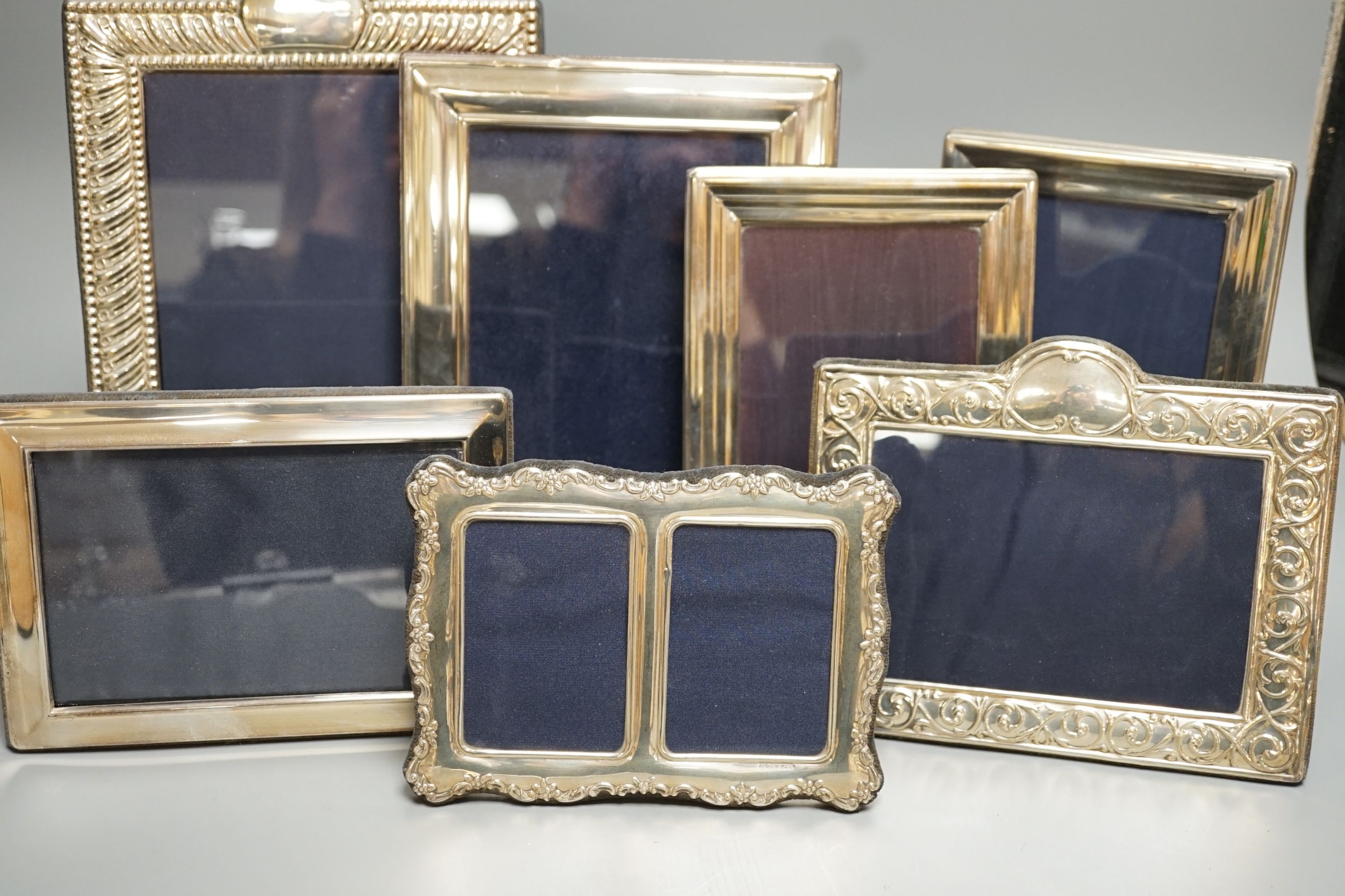 Seven assorted modern silver mounted photograph frames including a pair by JD Ltd, Birmingham, 2000, largest frame, 25.6cm